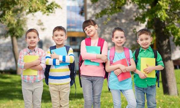 happy children with school bags and notebooks - Zdjęcie, obraz