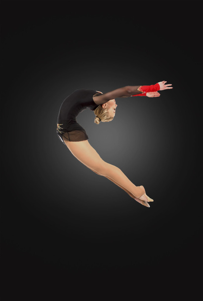 Ginasta profissional saltando em estúdio
 - Foto, Imagem