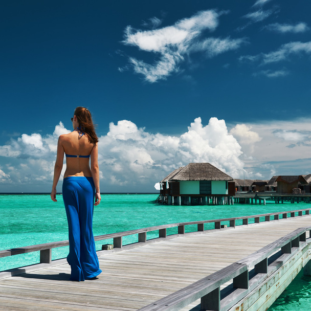 Woman on wooden jetty - Photo, Image