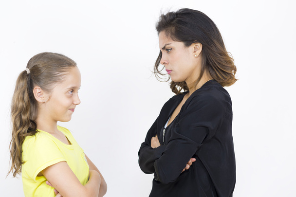 Angry Girl and Mother Over White Background - Foto, immagini
