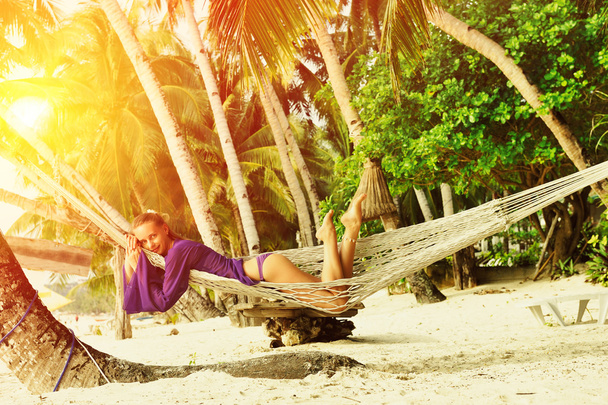 Woman in hammock on beach - Fotoğraf, Görsel