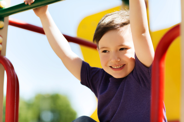 happy little boy climbing on children playground - Photo, Image