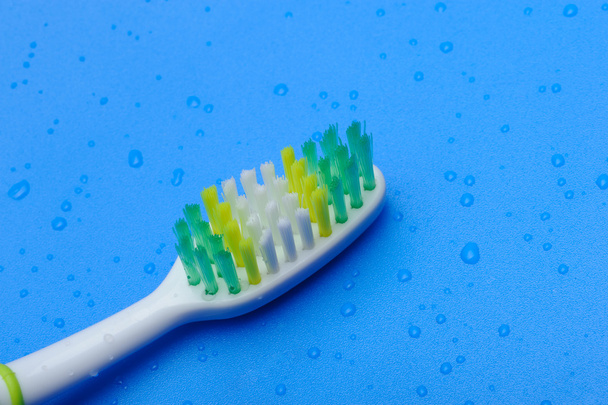 Toothbrush on a blue background - Fotografie, Obrázek