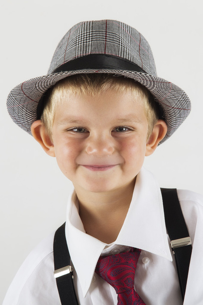 Portrait of a young boy with old hat being funny - Foto, Bild