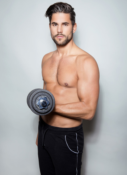 handsome young bodybuilder posing shirtless - Fotografie, Obrázek