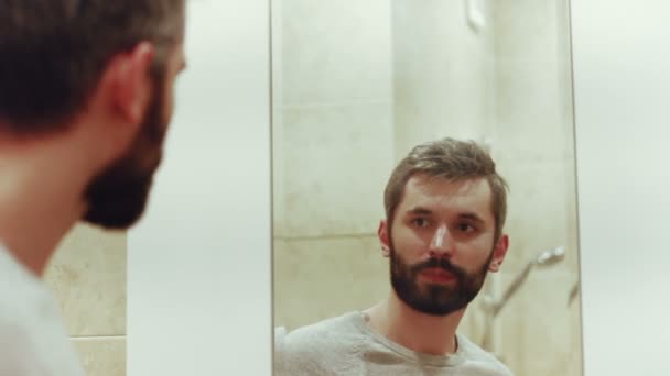 Handsome Men With Beard Behind the Mirrow and Smoking - Felvétel, videó