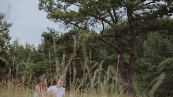 Beautiful Pair in White Clothes in the Woods - Materiał filmowy, wideo