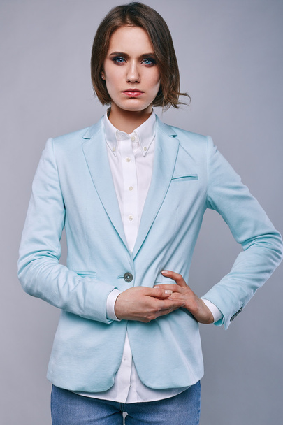 fashion portrait of young elegant woman in azure man jacket - Фото, изображение