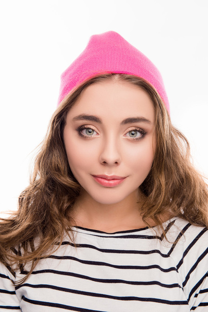 Portrait of beautiful young woman in pink hat and curly hair - Fotó, kép