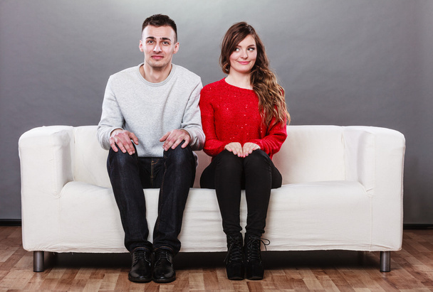 Shy woman and man sitting on sofa. First date. - Фото, зображення