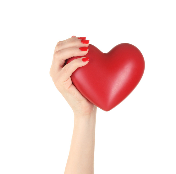 Corazón rojo en la mano de la mujer aislado en blanco
 - Foto, Imagen