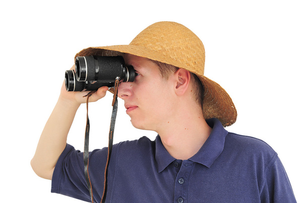 Young man with binoculars and straw hat - Photo, Image