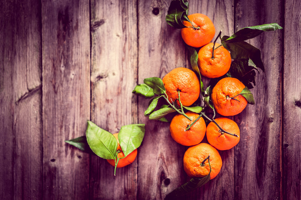 Tangerines on rustic background - Foto, imagen