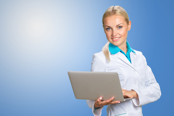 smiling doctor woman in medical gown - Foto, Imagen