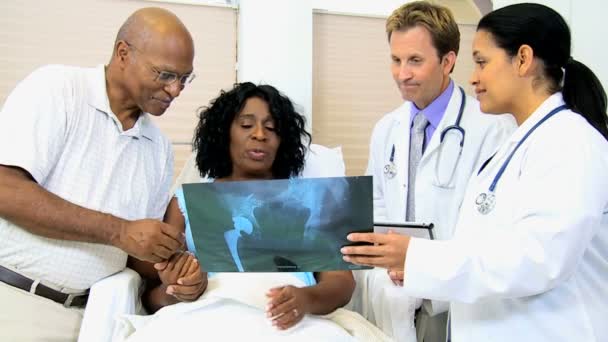 Radiology staff discussing x-ray result with patient - Footage, Video