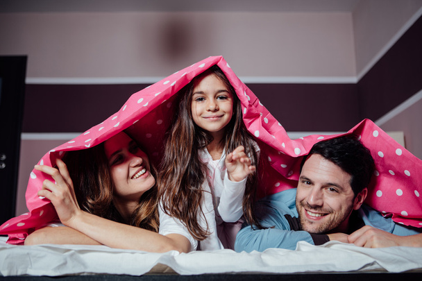 happy family under a blanket - Фото, зображення