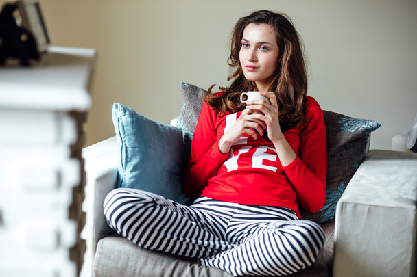 young woman relaxing in pyjamas  - Foto, afbeelding