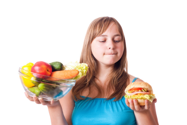 Girl with vegetables and hamburger - Photo, Image
