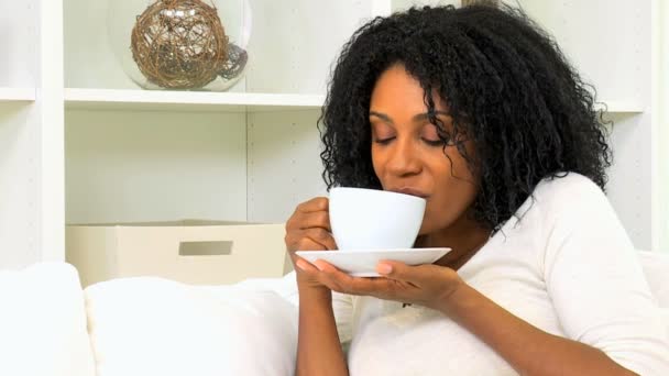 woman enjoying cup of coffee at home - Filmati, video