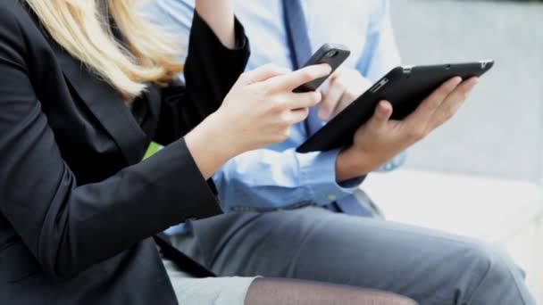 business male and female using digital devices - Footage, Video