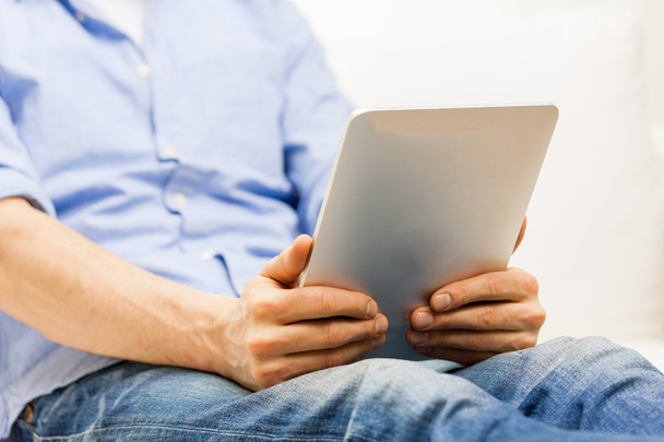 close up of man working with tablet pc at home - Photo, Image
