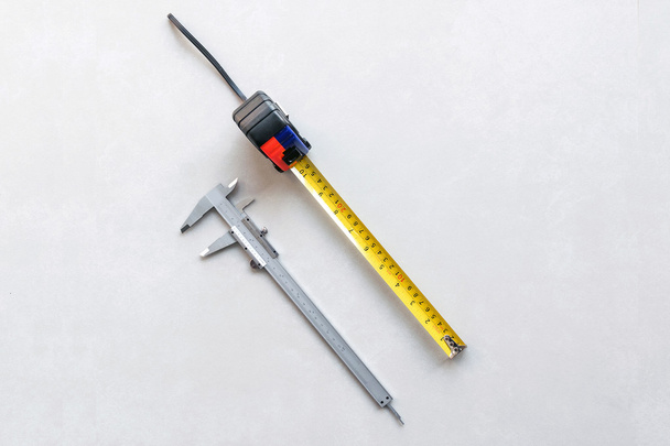 Vernier and measuring tape. - Photo, Image