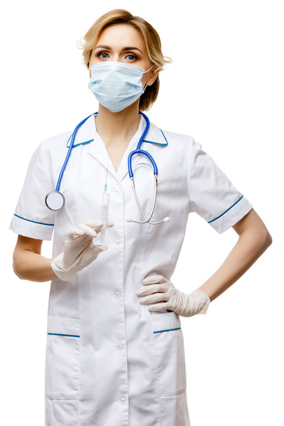 Mulher médico em pé sobre fundo branco
 - Foto, Imagem