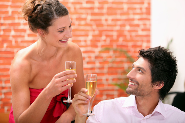 Couple drinking champagne in restaurant - Фото, зображення