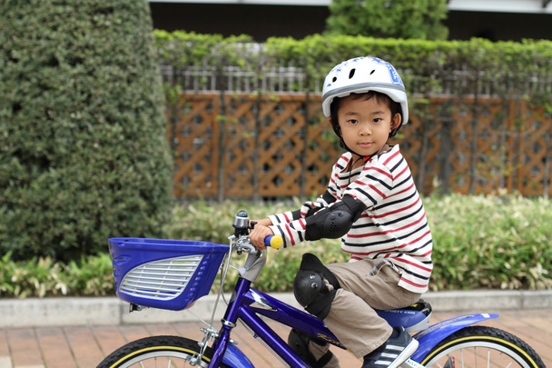 Japanese boy riding on the bicycle (5 years old) - Photo, Image