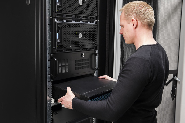 It consultant install network router in datacenter - Photo, Image