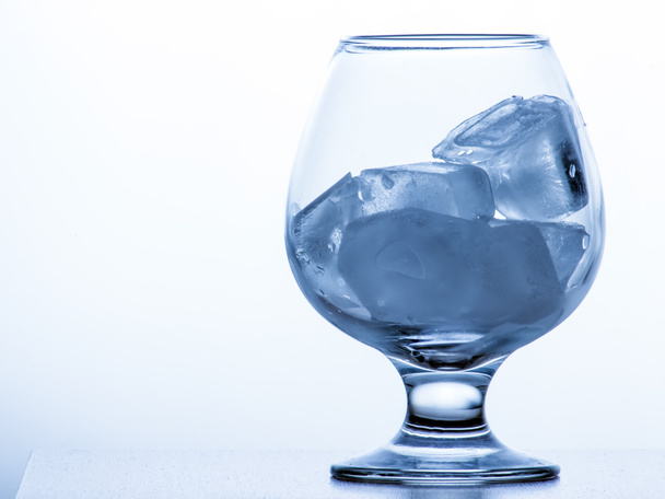 Glass with ice cubes isolated on white background - Valokuva, kuva