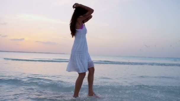 Chinese girl in white dress dancing on beach - Footage, Video