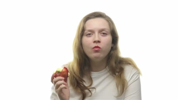 Fatty woman eating apple - Materiał filmowy, wideo