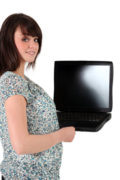 Young woman holding a laptop with a blank screen - Photo, Image