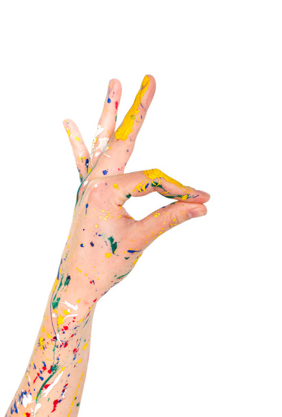 Mujer mano en pintura con signo de atención
 - Foto, imagen