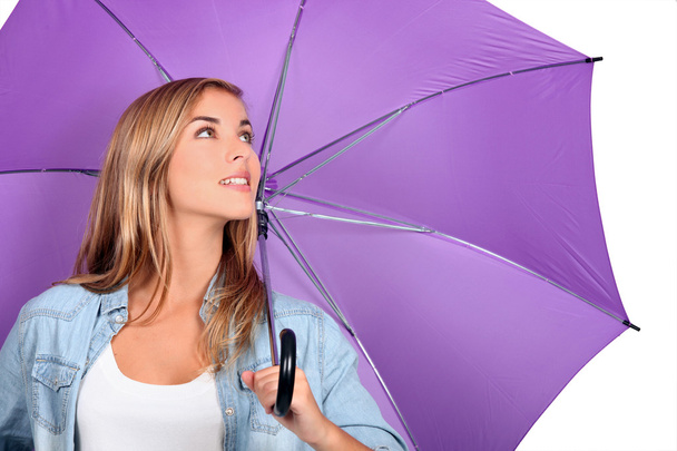 Blond woman with purple umbrella open - Foto, immagini