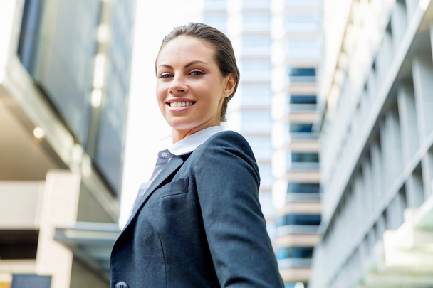 Portrait of business woman smiling outdoor - Photo, Image