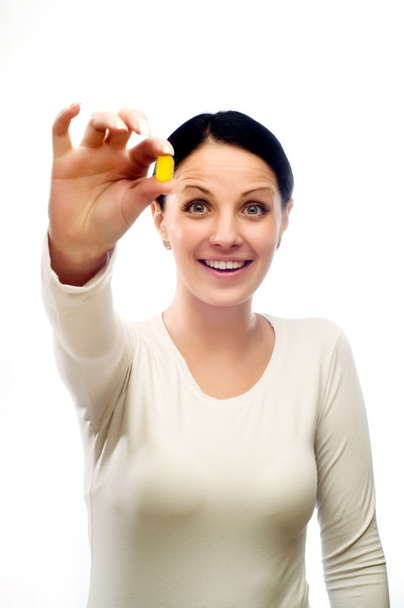 Young happy woman with capsule - Photo, image