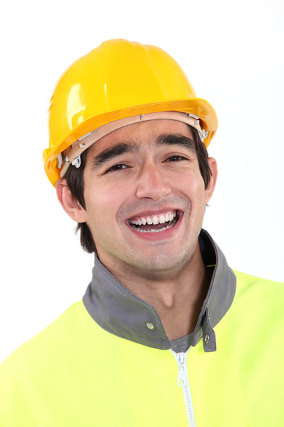 Worker wearing reflective jacket - Фото, изображение