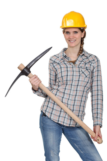 Woman posing with pick-axe - Foto, afbeelding