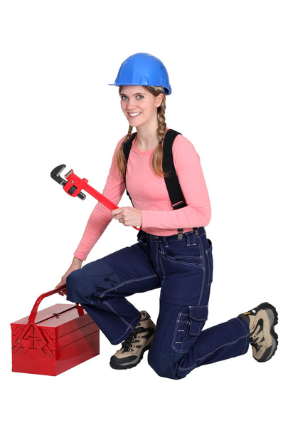 Female plumber and her equipment - Foto, Imagen