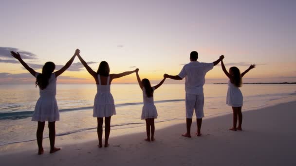 Caucasian family enjoying beach vacation at sunset - Footage, Video