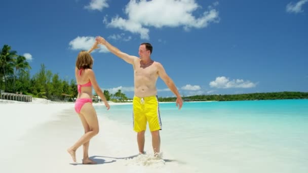 Caucasian couple enjoing vacation on beach  - Footage, Video