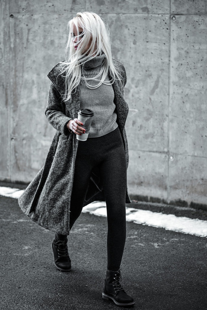 Stylish lovely young woman walking outside - 写真・画像