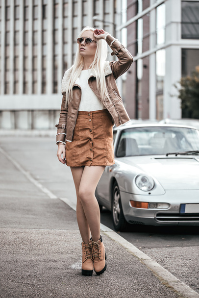 Blonde young woman posing outside - Photo, image