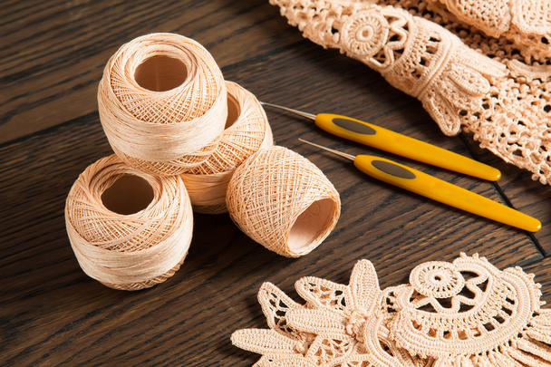 beautiful yarn Irish lace on the wooden background - Foto, Imagem