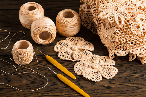 beautiful yarn Irish lace on the wooden background - Foto, Imagem