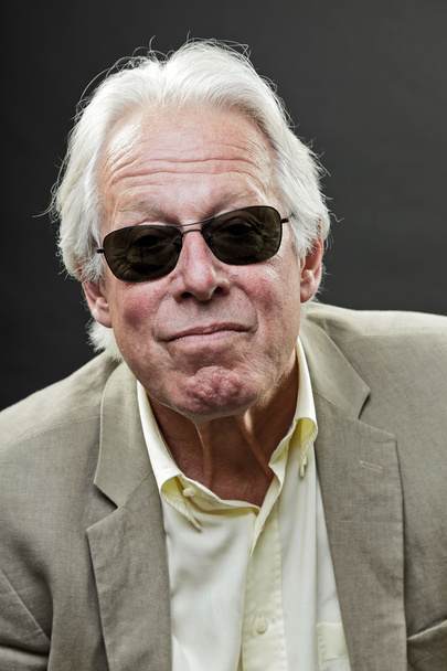 Senior business man wearing black sunglasses and light suit. - Фото, изображение