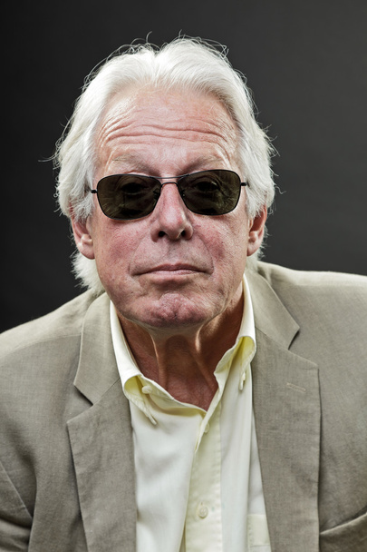 Senior business man wearing black sunglasses and light suit. - Фото, зображення