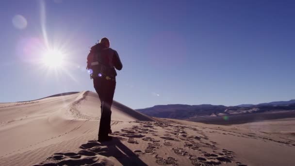 woman explorer walking through sand dunes  - Footage, Video